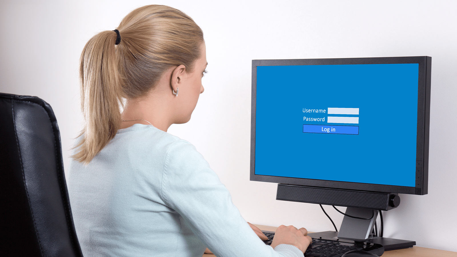 woman entering in login information