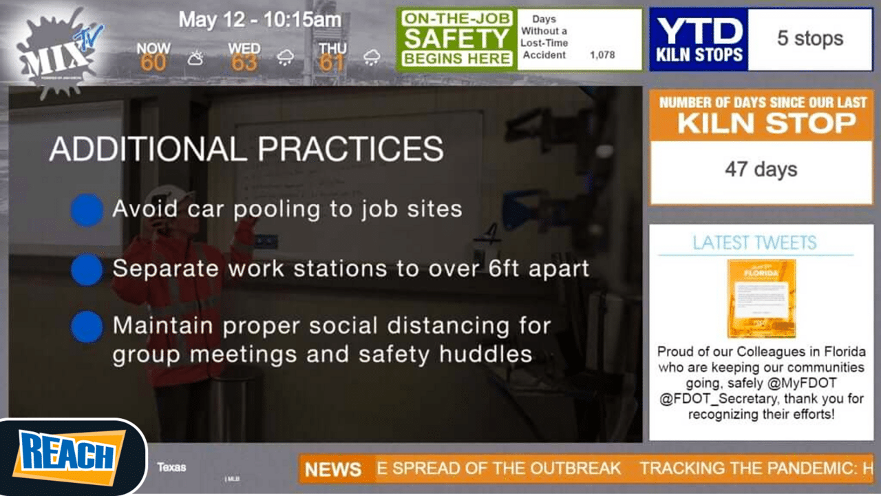Person presenting health and safety guidelines for maintaining social distancing in the workplace during a pandemic, utilizing digital signage.