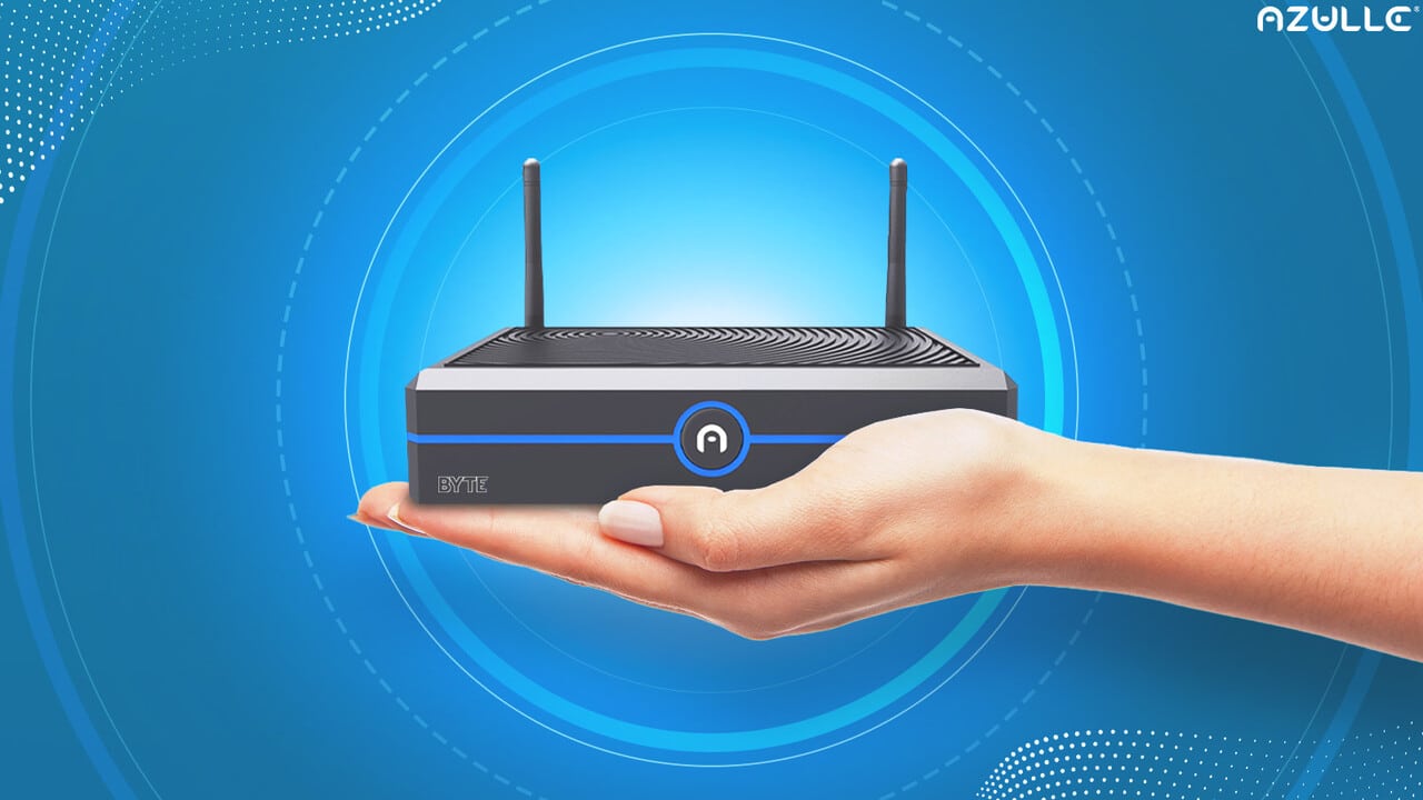 A hand holding a mini PC with two antennas, displayed against a blue abstract background featuring subtle Windows 11 themes.
