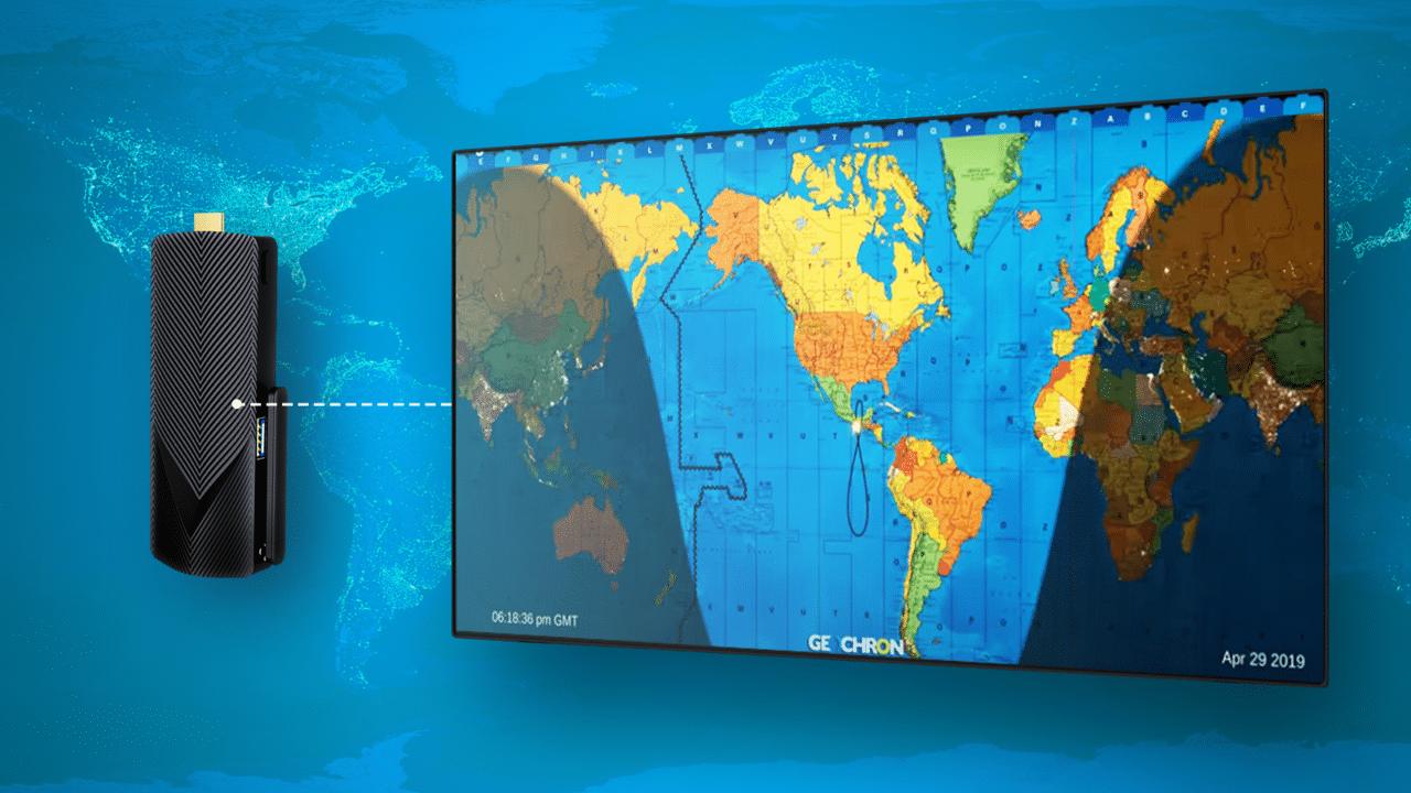 A digital timepiece with a world map and an Azulle Mini PCs.
