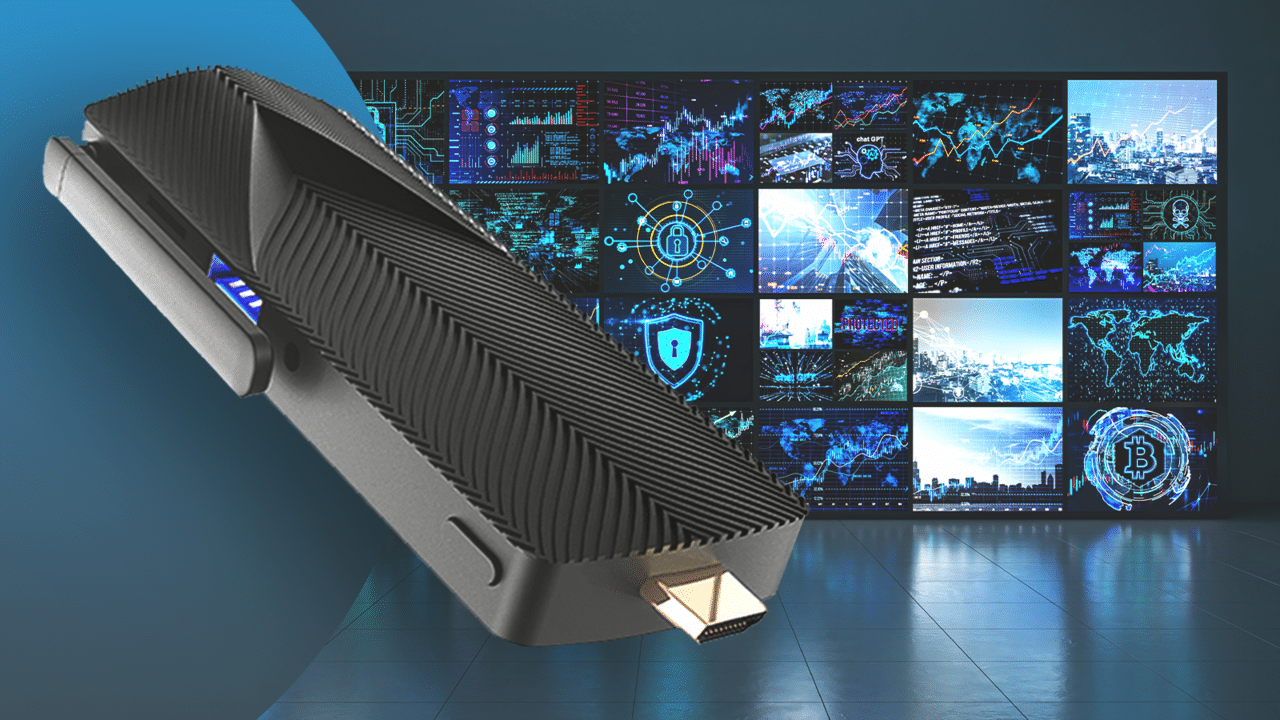 A black mini PC with a ridged design and HDMI connector is displayed in the foreground. In the background, the CORTROL video Wall System from Ganz Security showcases various digital graphics and data visualizations on a large screen wall.